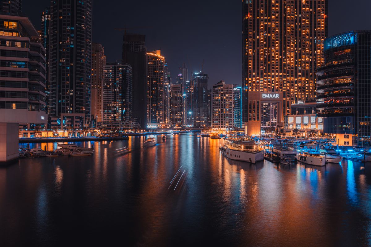 The towers doubled in the still black water