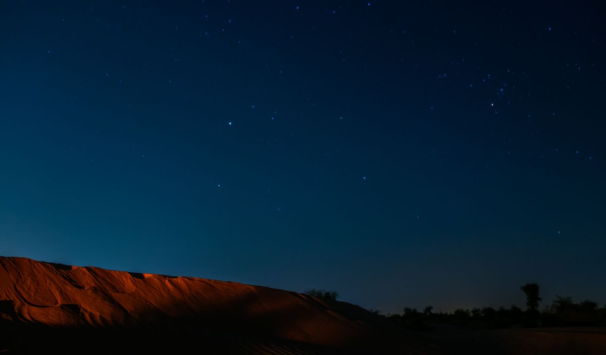 The Milky Way over the darkened camp