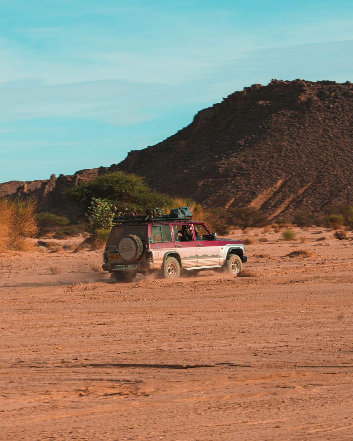 The private drive across rugged, empty desert