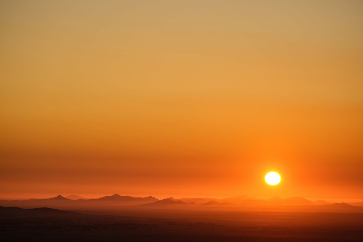 Mist softening the dunes as the sun goes down