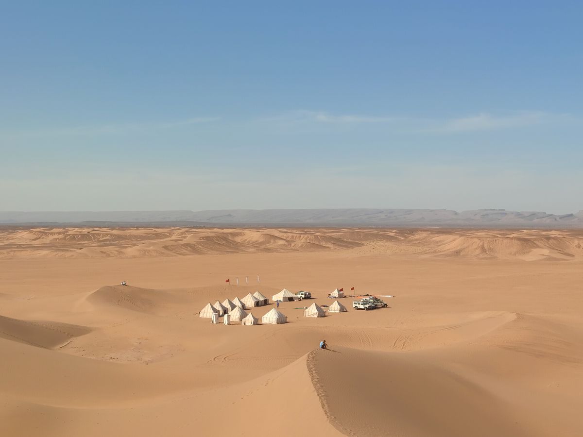 A private camp set alone among the Sahara-like dunes