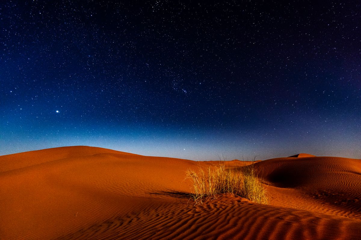 The night sky opening over the dunes