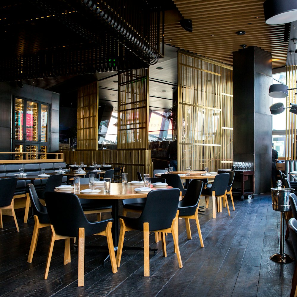 A long dining table set in a warmly lit venue